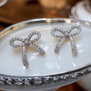 CZ Silver Bow stud earrings. New.